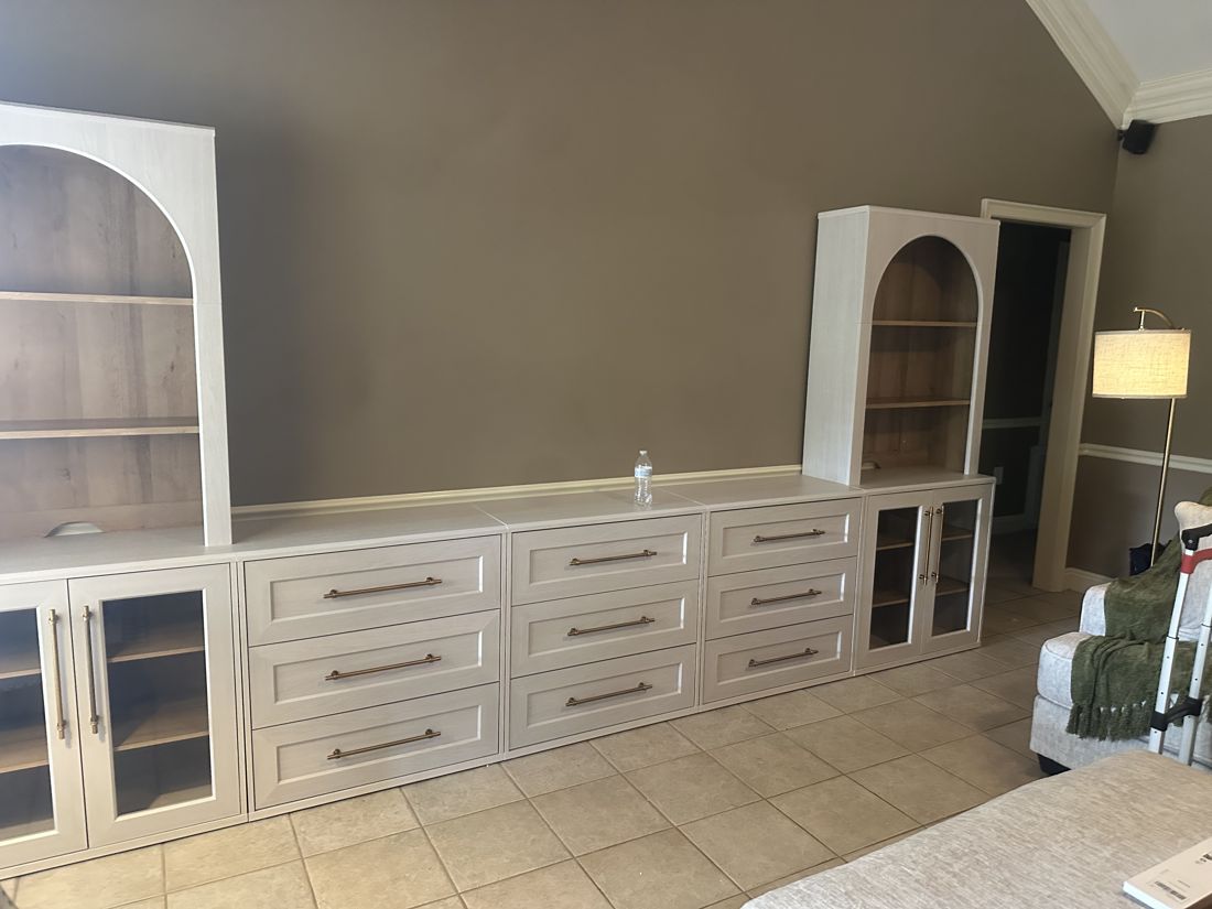 Built-in cabinets with arched shelves