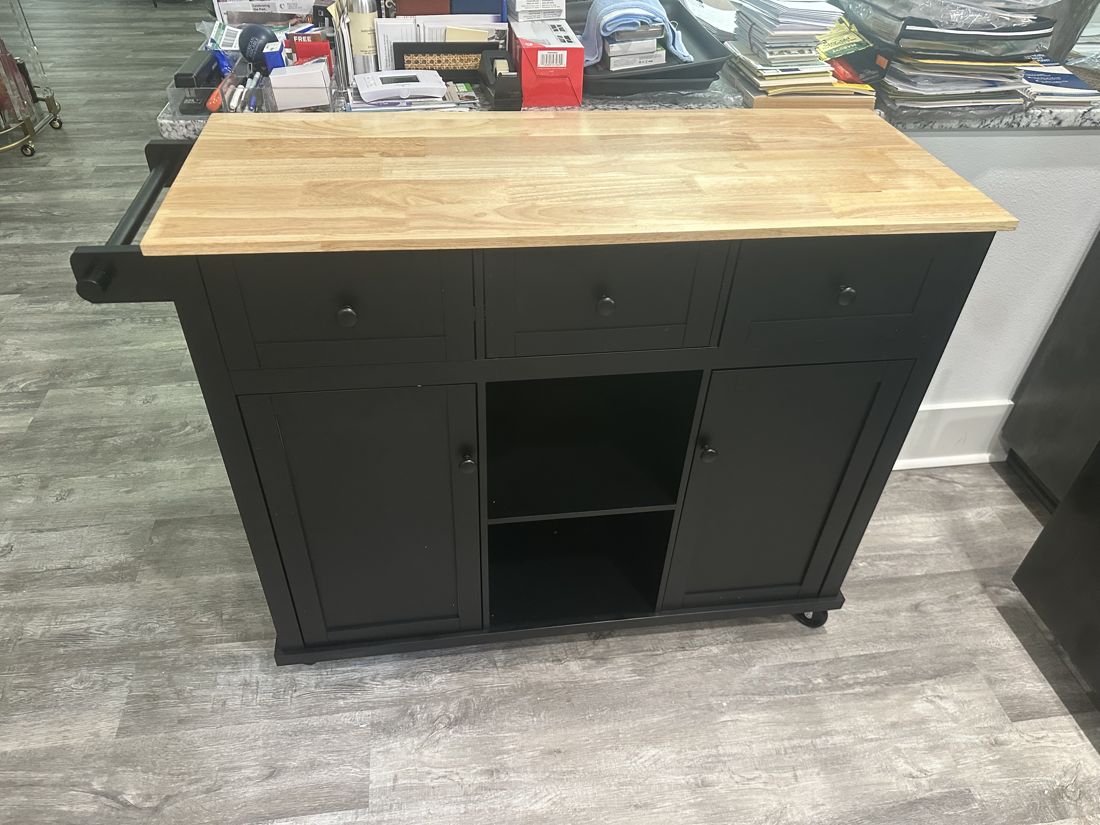 Assembled kitchen island with butcher block top